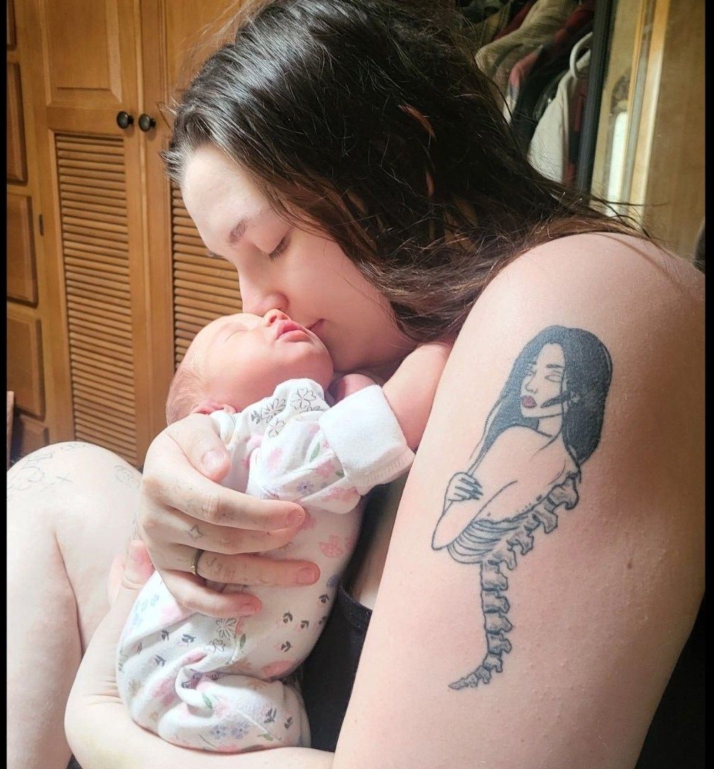 Holly with Baby E posted on social media in 2026